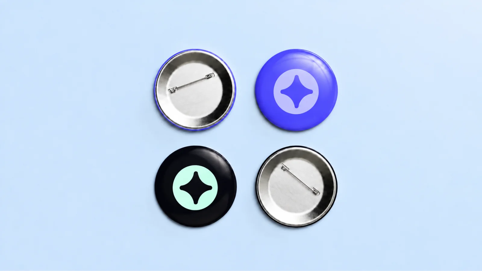 Four pin badges with the Civia star in blue, black and mint